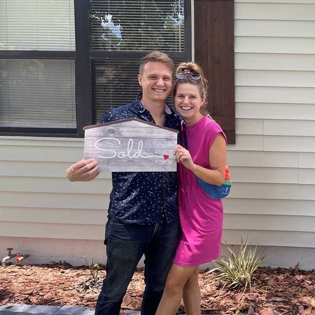 Happy homeowners with their new home